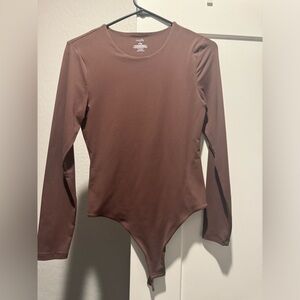 Nuuds long sleeve crewneck, bodysuit, and coffee